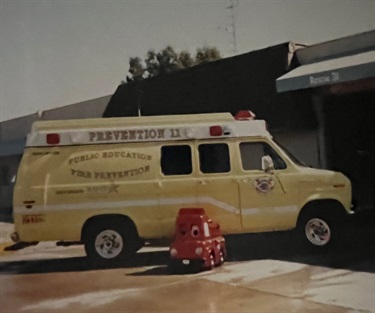 American Canyon Fire District prevention van parked outside a building.
